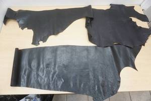 lot 57 image: Black Leather (2 pieces)