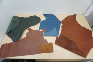 lot 63 image: Leather Pieces (4 pieces) Brown, Blue, Green
