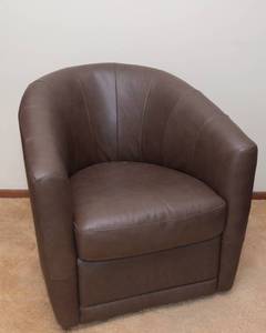 lot 92 image: Brown Swivel Chair  Barrel Shape - Likely Leather