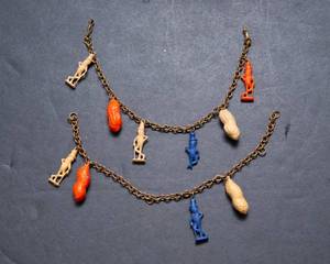 lot 517 image: 1940s Mr. Peanut Planters Peanuts Charm Bracelets  Set of Two