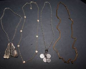 lot 507 image: Set of Four Necklaces  Includes Peso Coin Necklace