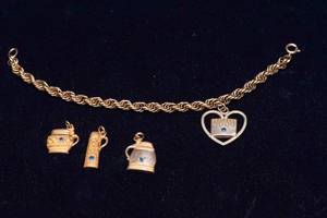 lot 547 image: Vintage Hamms 10K Gold Employee Bracelet with Charms