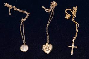 lot 551 image: Three Vintage Necklaces  Religious & Heart Lockets