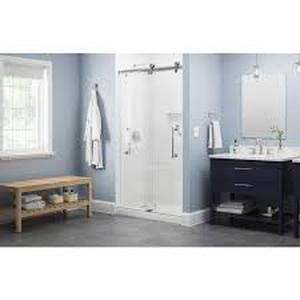 lot 30 image: Delta Paxos 42-14 to 48 in. W x 76 in. H Frameless Sliding Shower Door in Satin Chrome with 516 in. Clear Glass   Customer Returns See Pictures