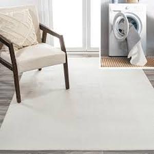 lot 55 image: JONATHAN Y Twyla Classic Cream 8 ft. x 10 ft. Solid Low-Pile Machine-Washable Area Rug  Customer Returns See Pictures