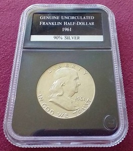 lot 7 image: Slabbed 1961 Uncirculated Franklin Half Dollar
