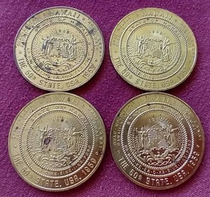 lot 28 image: (4) 1959 Hawaii $1 Tokens