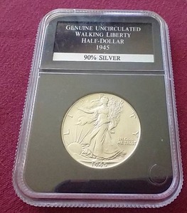 lot 56 image: Slabbed Uncirculated 1945 Walking Liberty Half Dollar