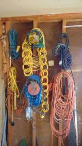 lot 54 image: Contents of Wall Corner. Extension Cords