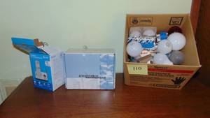 lot 110 image: Newer Cordless AT&T Phone, New Brass Faucet and Box of Light Bulbs
