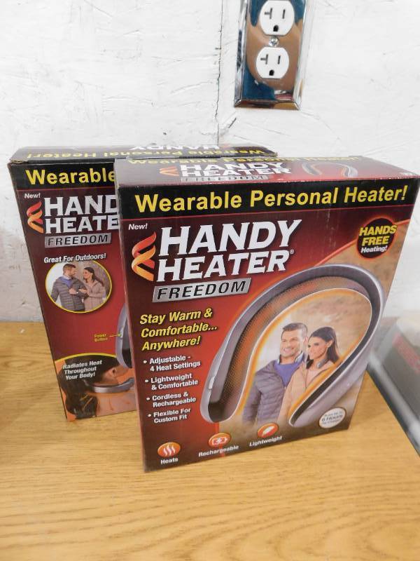 lot 41 image: (2) HANDY HEATER 450-Watt Silver and Black Electric USB Rechargeable Personal Wearable Neckband Heater