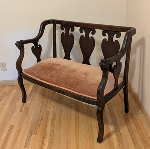 lot 60 image: ML - Antique Wood Settee with Pink Upholstered Seat and Carved Lion Armrests