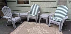 lot 100 image: P - Patio Furniture Set with 3 Gray Plastic Chairs, 2 Ottomans, and Outdoor Rug