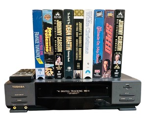 lot 180H image: LL - Toshiba M-447 VHS Player with Remote and Lot of 9 VHS Movies