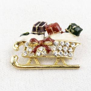lot 46 image: Holiday Sleigh Brooch with Rhinestones and Gift Accents
