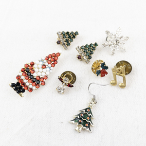 lot 52 image: Lot of 7 Vintage Holiday Brooches and Pins - Christmas Tree, Santa, Snowflake, Angel, and Music Note Designs