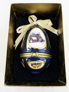 lot 99 image: Mr. Christmas Blue Porcelain Hinged Egg Ornament with Church Scene