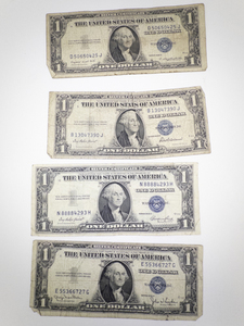 lot 391 image: 4 Silver Certificate Dollar Bills 1935 D E F G Series