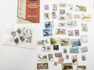 lot 426 image: Vintage World Wildlife Postage Stamp Collection with 1980-81 Stamp Catalog