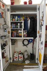 lot 38 image: Contents of Cabinet - Riding Gear, Solder Irons, Lawn and Garden Chemicals