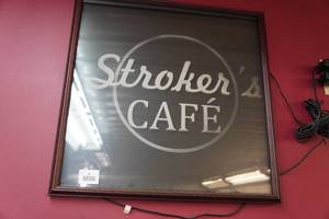 lot 67 image: Strokers Caf Sign