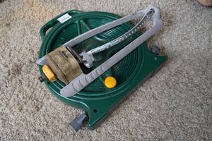 lot 172 image: Hose Reel with Hose and Sprinkler