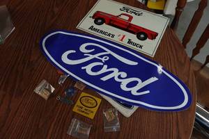 lot 132 image: Ford Sign, Large Sticker, and Pins