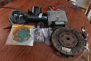 lot 145 image: Ford Parts - Radio, Distributor Cap, Speedometer