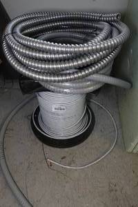lot 438 image: Spool of Wire, Conduit