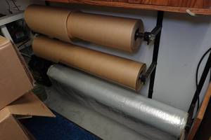 lot 483 image: Paper and Sheeting Dispenser Rack with Rolls