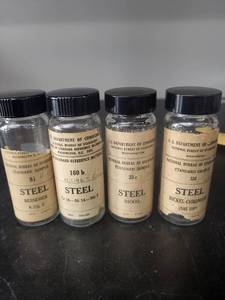lot 78L image: Set of 4 National Bureau of Standards Steel Reference Sample Bottles
