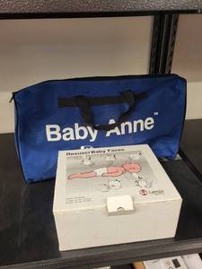 lot 95L image: Laerdal Baby Anne CPR Training Manikin with Carry Bag and Resusci Baby Faces