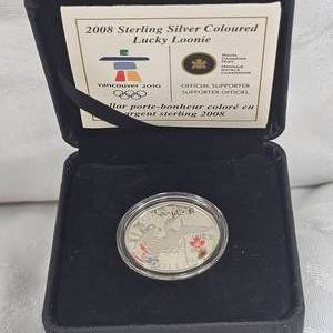 lot 10 image: 2008 Coloured Lucky Loonie Sterling Silver Coin
