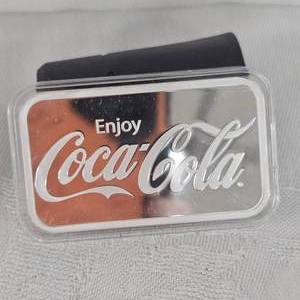 lot 32 image: Coca Cola 1 oz-.999 Silver Bar