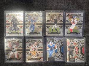 lot 24 image: 2023 Panini Select NFL Rookie and Star Football Card Lot (8 Cards) - Robinson, LaPorta, OConnell, DeVito, Hurts and More