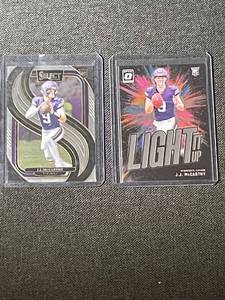 lot 50 image: Set of 2 J.J. McCarthy Rookie Football Cards - 2024 Select & Donruss Optic Light It Up