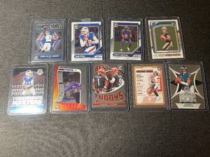 lot 66 image: Collection of 9 2024 Panini NFL Football Trading Cards Including Amon-Ra St. Brown, Josh Allen, Lamar Jackson