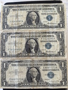 lot 64 image: 1957 Blue Seal $1 Dollar Silver Certificates