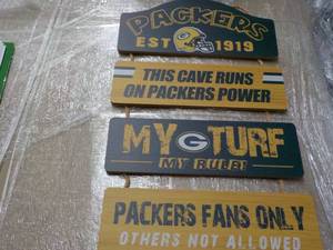 lot 109 image: Packer Wood Signs...