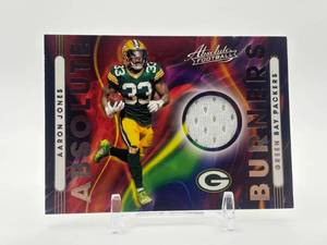 lot 442 image: 2021 Panini Absolute - Absolute Burners Relics Aaron Jones Patch Jersey Card Green Bay Packers and Minnesota Vikings