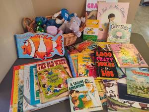 lot 93 image: Collection of Toddler Board Books and Basket of Stuffies