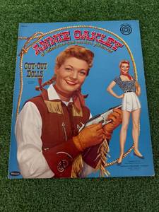 lot 10 image: Annie Oakley Cut-Out Dolls