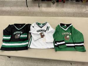 lot 97 image: 3 UND Sioux Hockey Jerseys Size 78