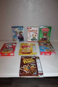 lot 6 image: Collection of 7 Assorted Branded Cereal Boxes Including Holiday Editions
