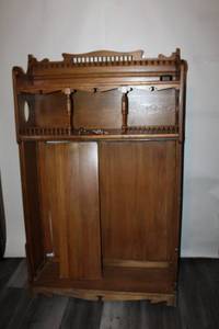 lot B-49 image: Antique Wooden Hall Tree Stand with Ornate Detailing