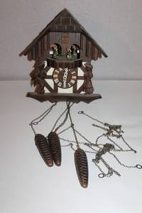 lot 56 image: Vintage Black Forest-Style Wooden Cuckoo Clock with Dancing Figures and Pinecone Weights