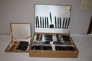 lot 71 image: Stainless Steel Flatware Set with Black Handles in Presentation Cases