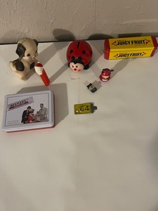 lot 101 image: Vintage Collectibles Lot with Beemans Gum, Ladybug Bank, Santa PEZ, and Toys