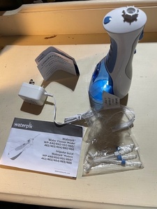lot 122 image: Waterpik Water Flosser Model WP-440450455460 with Accessories