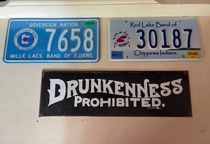 lot 143 image: Native American License Plates and Drunkenness Prohibited Sign Collection
